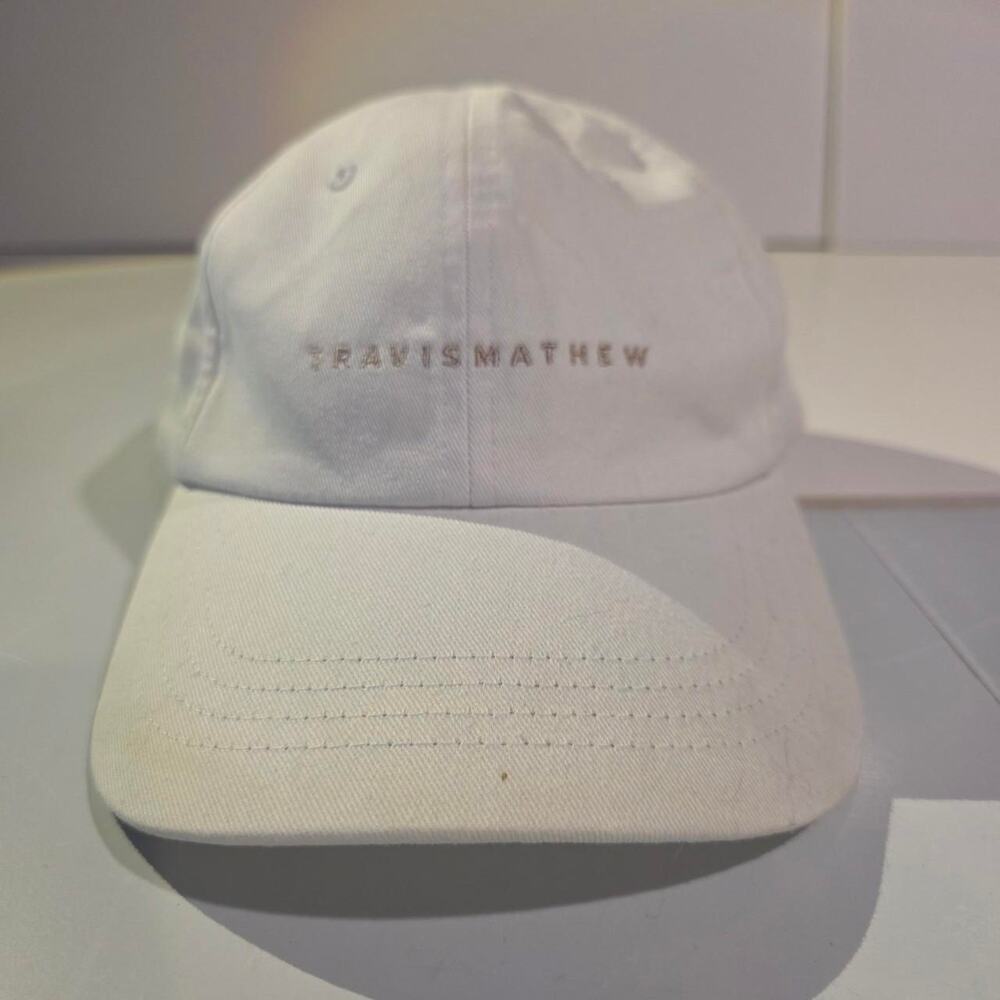 Travismathew white embroidered script logo